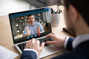 Back,View,Of,Businessman,Talk,With,Male,Business,Partner,Using Back,View,Of,Businessman,Talk,With,Male,Business,Partner,Using